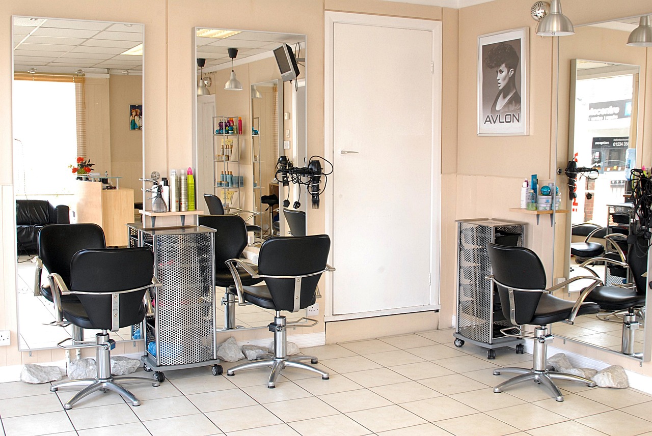 A bright, modern salon interior with styling stations